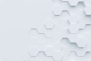 White hexagonal pattern on a light gray background, creating a layered 3D effect. The modern design conveys simplicity and elegance.